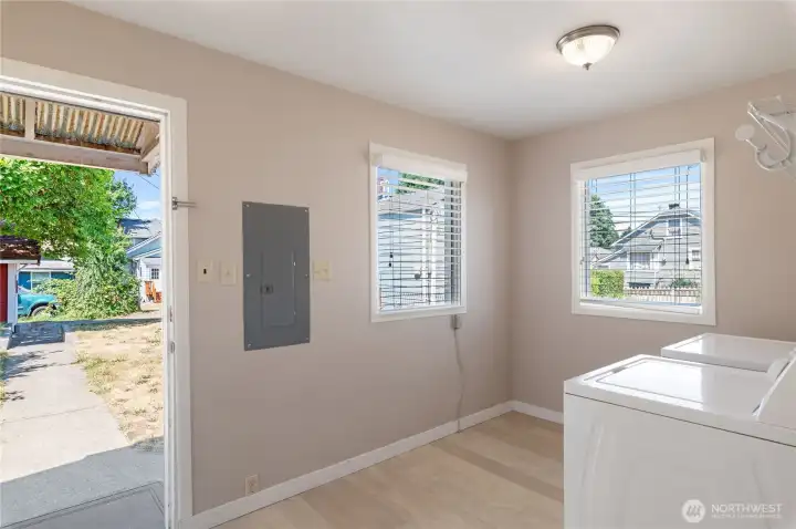 Laundry room/mud room with access to backyard and driveway. Washer and dryer convey. Laundry room/mud room with access to backyard and driveway. Washer and dryer convey.