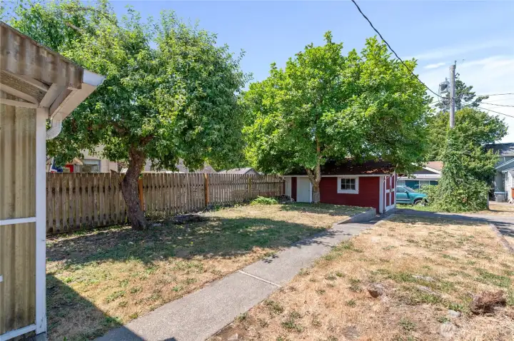 Backyard opens to alley and driveway parking. Backyard opens to alley and driveway parking.