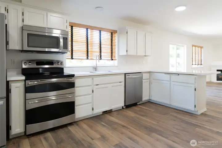 The right side Counter is huge Eating Bar, New sink and upgraded faucet with Mult-pcs of racks, cut boards taylored for the sink The right side Counter is huge Eating Bar, New sink and upgraded faucet with Mult-pcs of racks, cut boards taylored for the sink