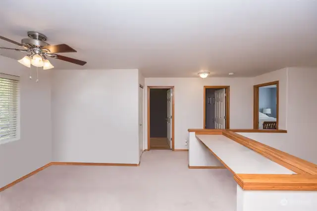Loft area with built in counter/desk space.  Furniture has been virtually removed.