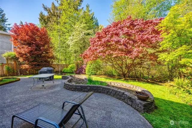 Enjoy this oasis of a back yard with wildlife and mature landscaping