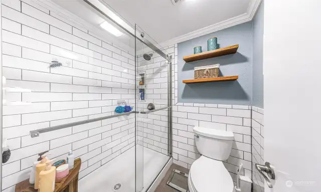 Primary bathroom with newer tile shower