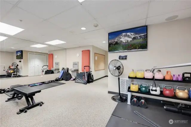 Another photo of the gym & flat screen TV to catch up on your favorite programs.