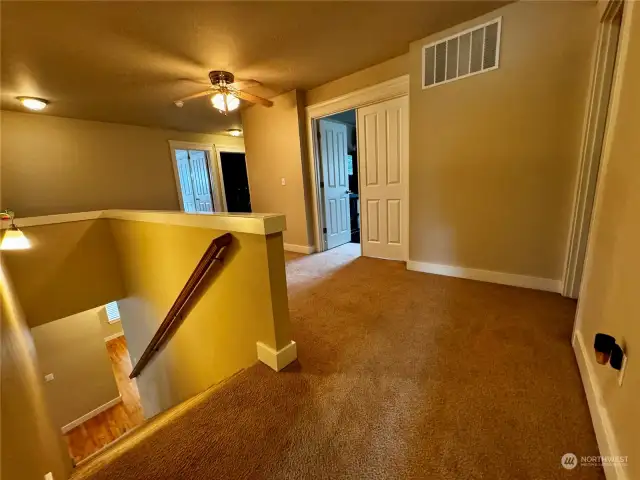 Upstairs landing with a large hallway.