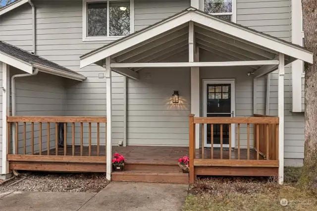 Porch perfection! With a vaulted ceiling and ample space for sitting, this covered front porch has room for holiday decorations, cozy seating, and even plants that need a little rain. Plus, the large deck gives you the flexibility to enjoy every season in style.