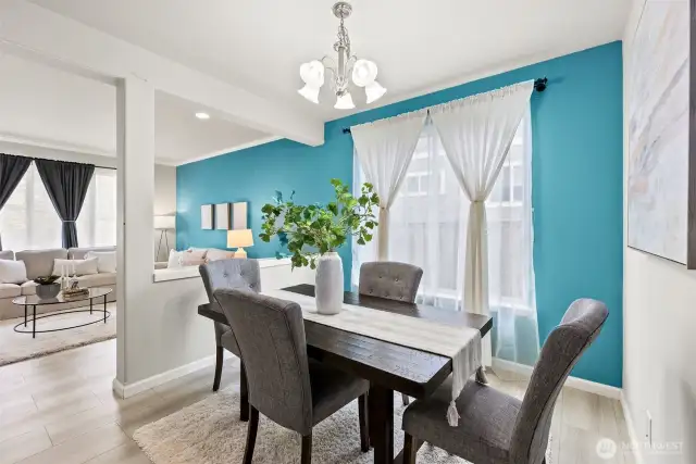 The dining room is ready to host your formal meals with your dinner guests. A pretty accent wall adds a touch of style that complements both the living and dining room.