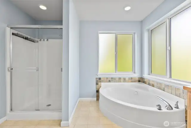 This divine primary bath features a soaker tub and walk in shower to start and end your day.