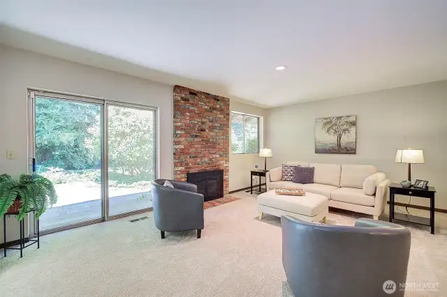 Spacious Family Room with gas fireplace and slider opens to patio and huge backyard.
