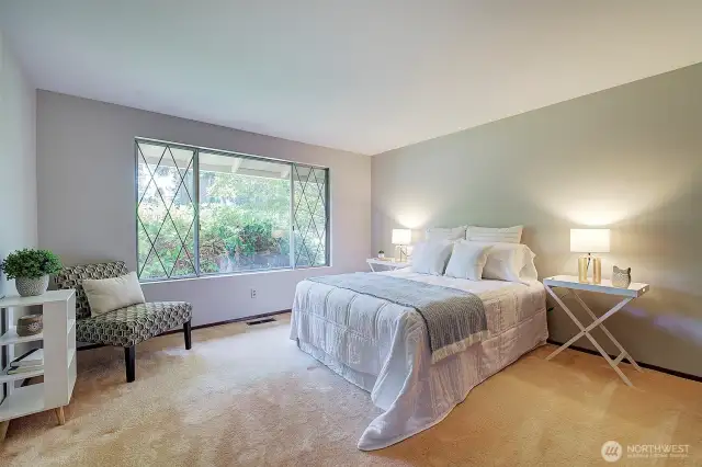 Bedroom 2 w/hardwood floors under the carpet.