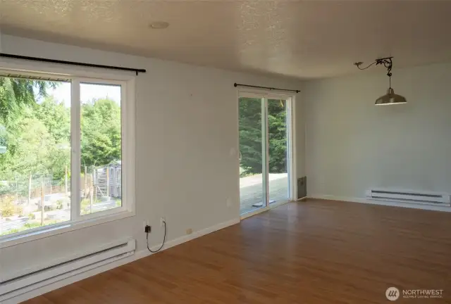 Great room with big picture window and slider to backyard