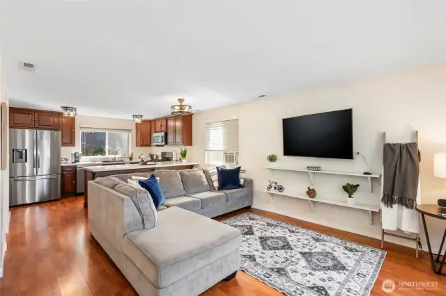 Open living main floor with laminate flooring.