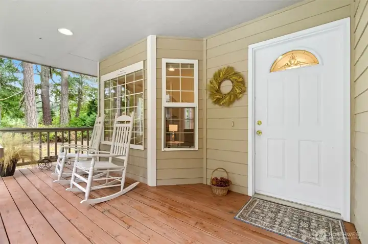 Cedar deck and a closed in ceiling - the front porch sets a welcoming tone.