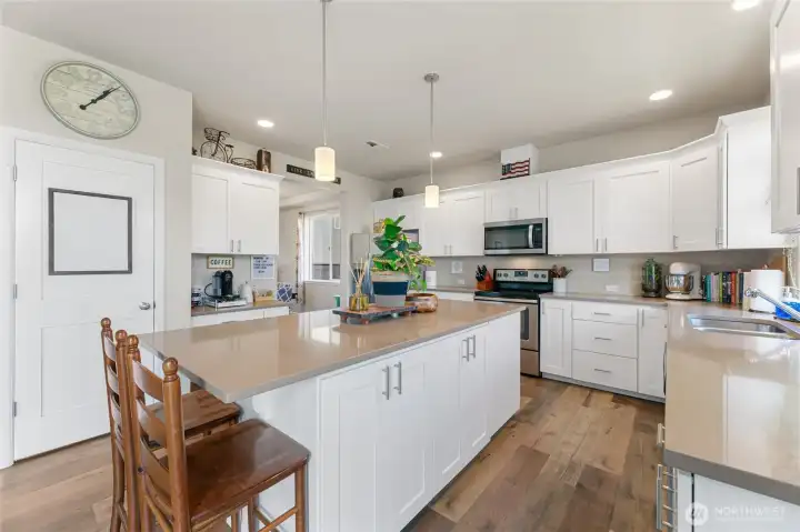 Kitchen has vaulted ceilings with an abundance of cabinets & counter space