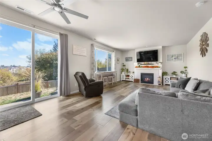 Open concept kitchen, dining with sliding door to a fully fenced backyard
