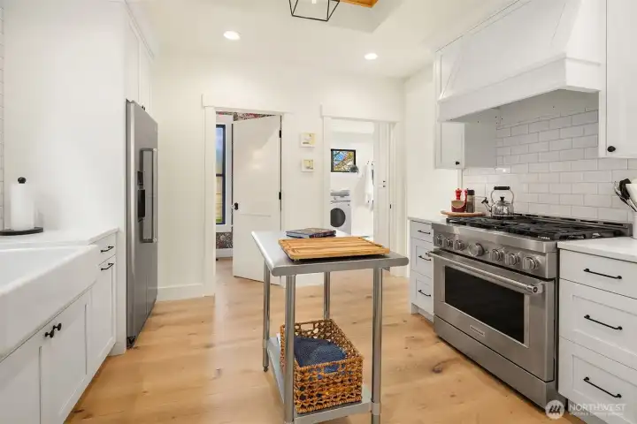 Stunning new kitchen with stainless appliances and natural gas range.