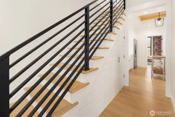 Thoughtful storage under the new stairs.