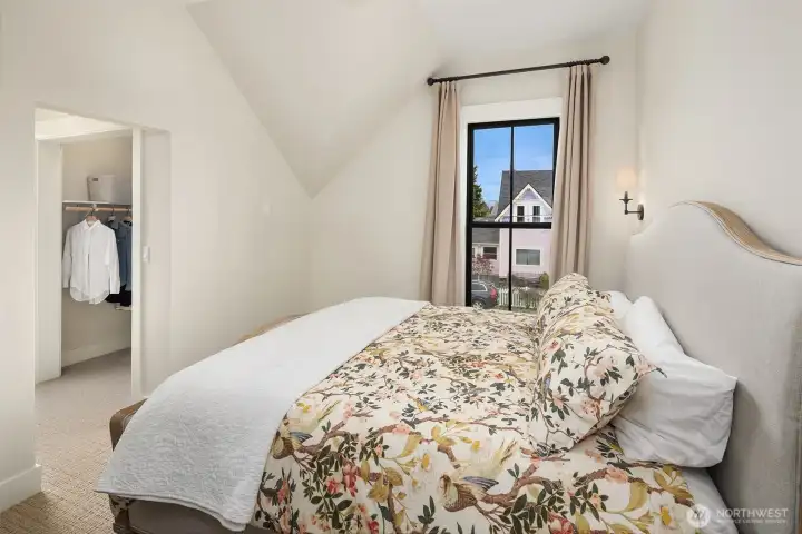 Primary bedroom with walk-in closet