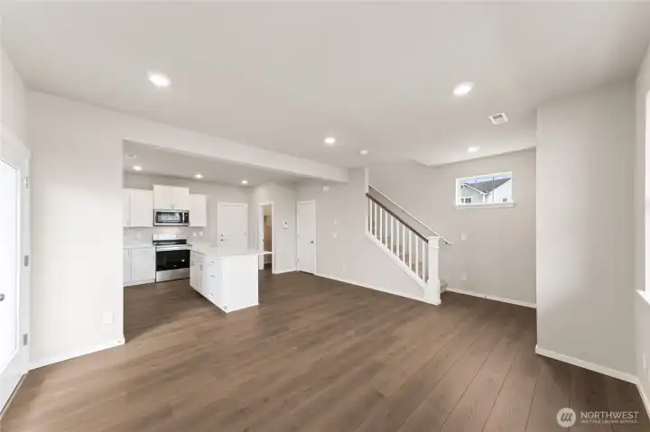 View from the heart of the kitchen into the bright and inviting great room—designed for easy everyday living.  Pictures are for representational purposes only, colors and features may vary.