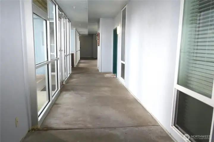 THE BUILDING HAS A COMPLETELY ENCLOSED MEZZANINE LEADING TO YOUR CONDO!