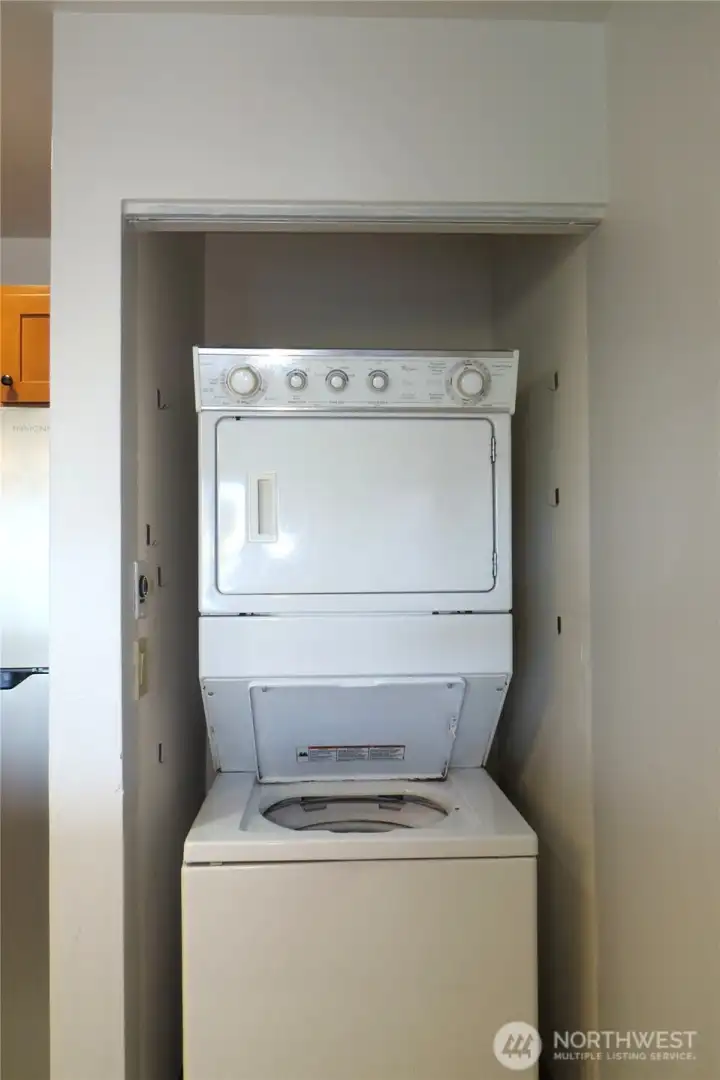 AT THE END OF THE KITCHEN IS A STACKABLE WASHER/DRYER!