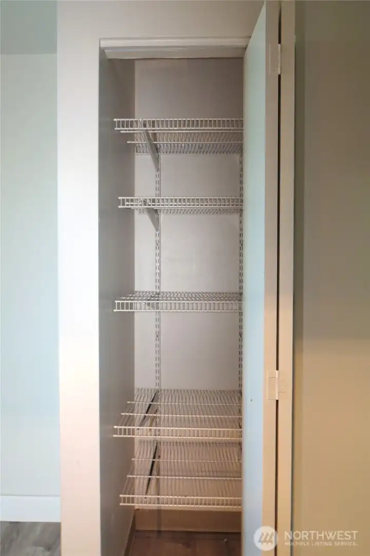 ACROSS THE HALL IS A SHELVED KITCHEN PANTRY!