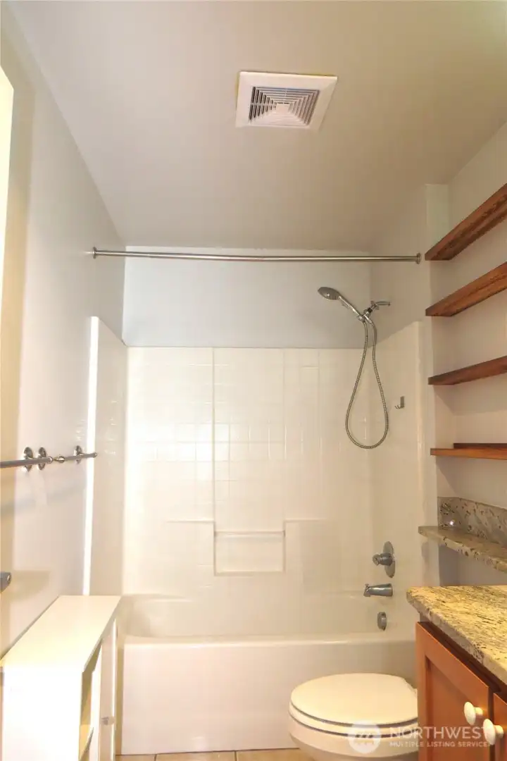 THE BATHROOM IS CENTRALLY LOCATED WITH A TUB/SHOWER COMBINATION!