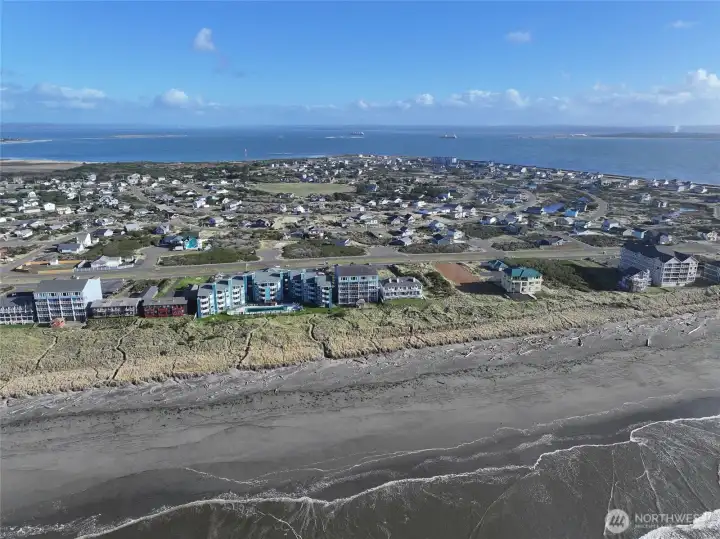 AERIAL VIEW OF OCEAN CREST AND IN THE BACKGROUND IS THE BAY WITH SHIPS GOING TO PORT!