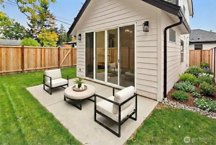 Private fully fenced backyard with patio.