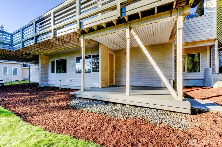 Lower level Bedrooms leads to covered patio and backyard