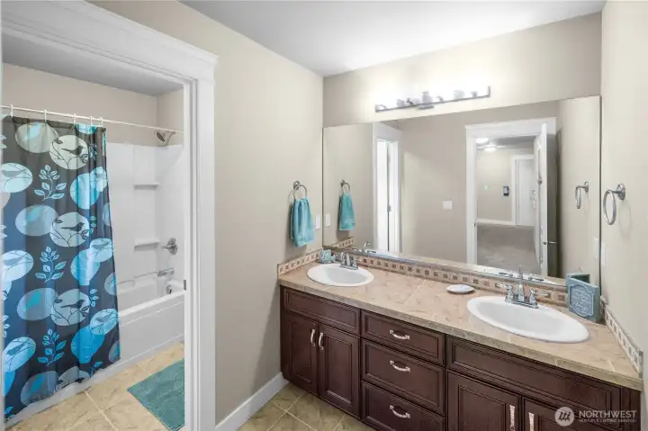 Main full bath upstairs. Double sinks, separate shower/toilet area