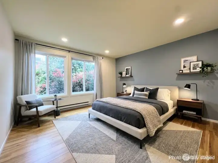 The primary bedroom has lots of natural light.