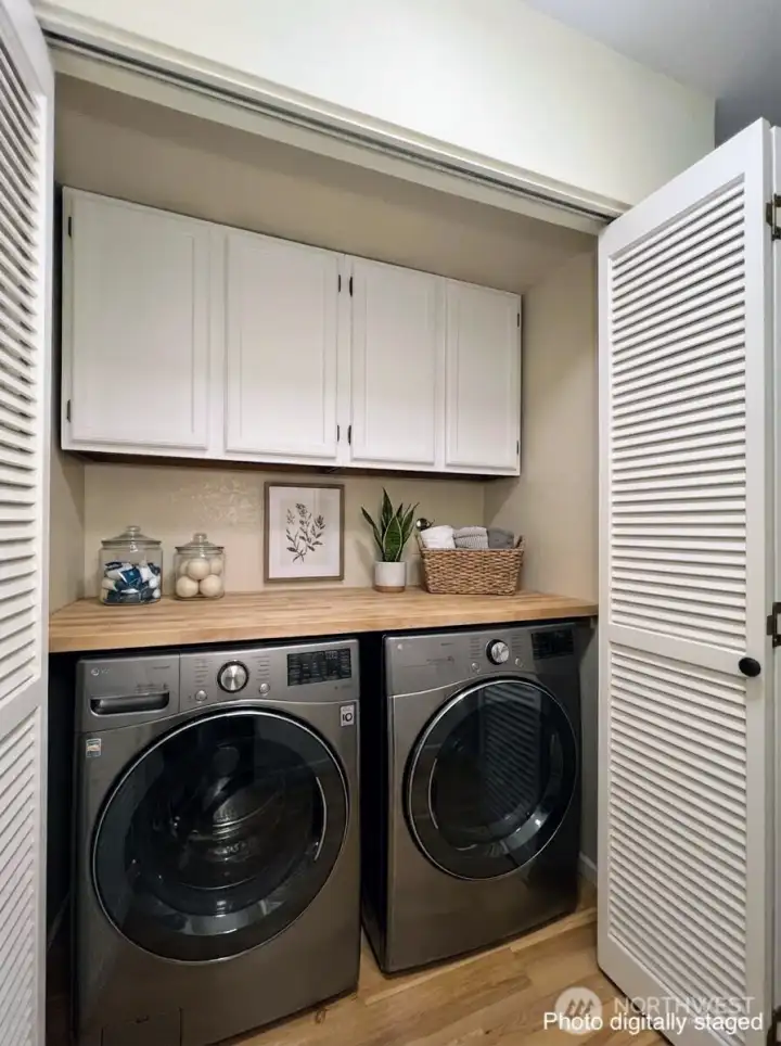 The laundry room can fit a full size washer + dryer.