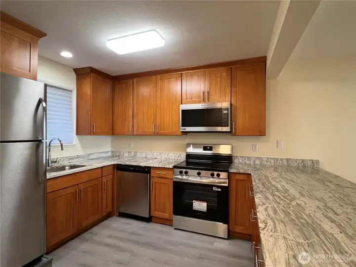 The kitchen has new stainless steel appliances.