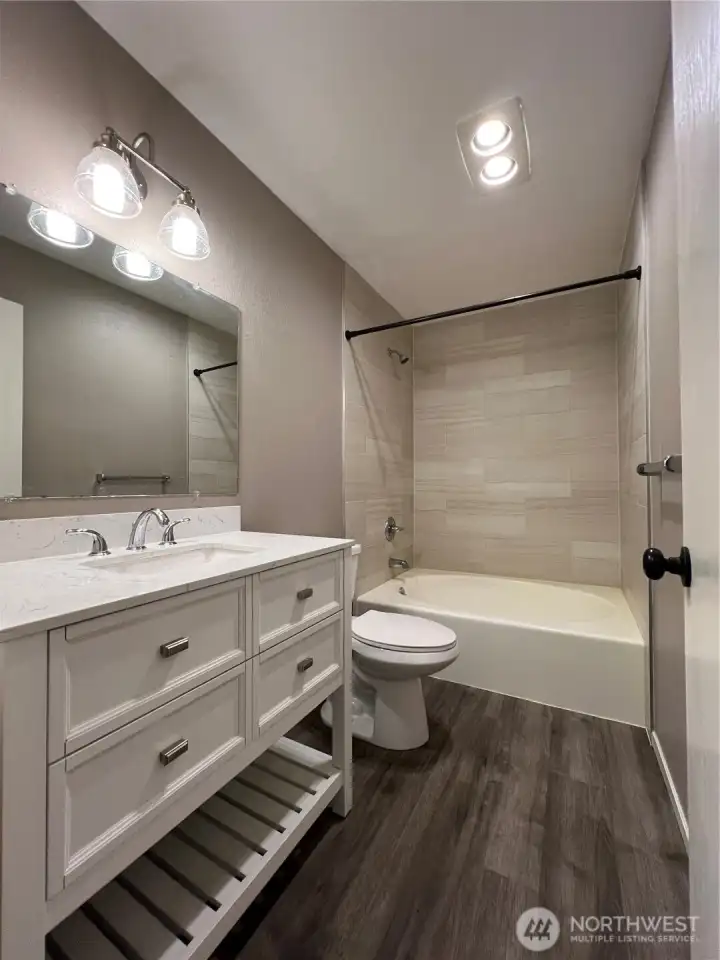 The hall bathroom has a over-sized tub.