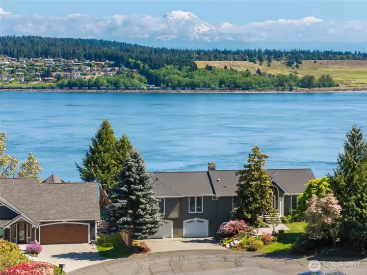 Panoramic views of Mt. Rainier, Puget Sound, and Chambers Bay Golf Course from nearly every room this beautiful Fox Island home.