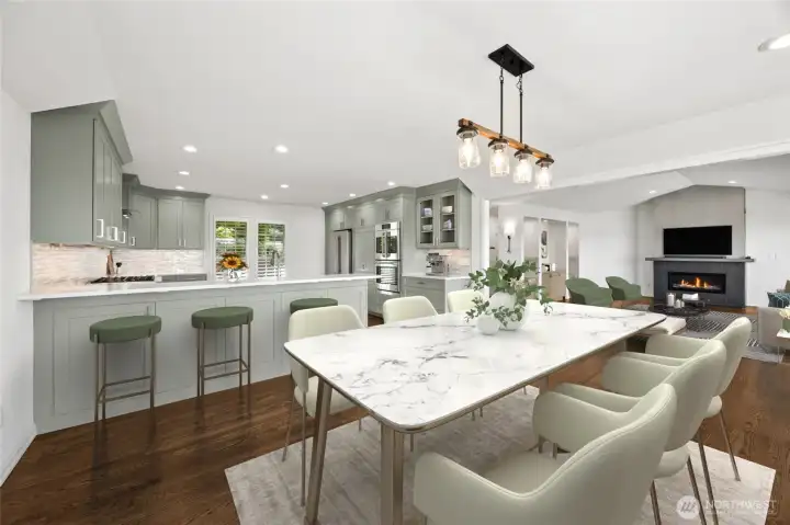 Enjoy effortless entertaining with a seamless layout that keeps you connected from the gourmet kitchen with breakfast bar to the family room and dining area. (staged photo)