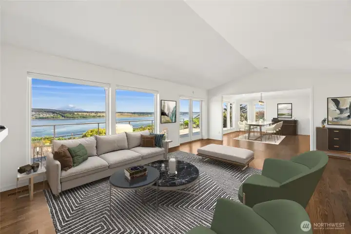 The open floorplan offers an effortless connection between indoor living and the tranquil beauty just outside. Timeless oak floors shine and add even more allure to this family room/dining area. (staged photo)