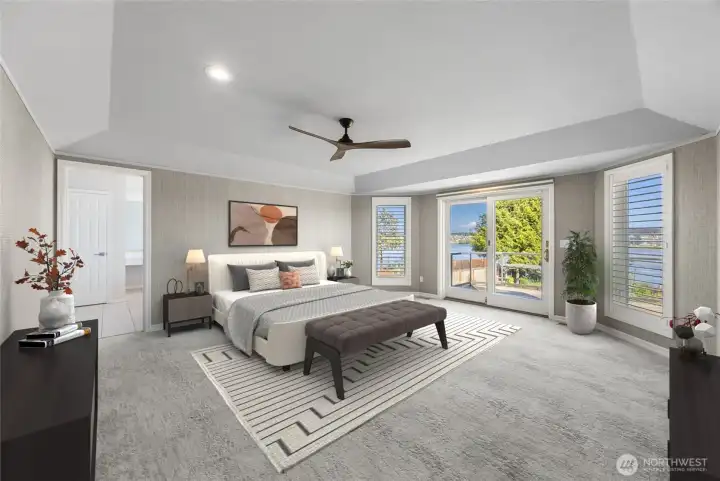 The primary suite offers a serene retreat  framed by expansive windows, designer  grass cloth walls, and French doors that open  to the spacious back deck over looking the  park-like backyard setting. (staged photo)