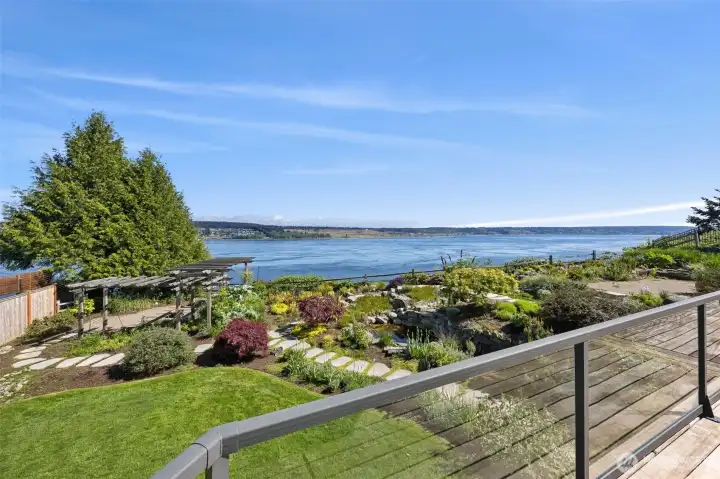 Imagine waking up everyday to this view just  off your primary suite to an ever changing  vista, eagles, orcas, swirling waters or clouds  over the mountain, you will find it hard to  look away.