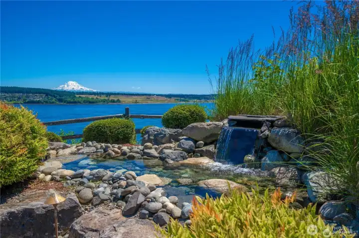 Serene park like back yard with sprawling gardens, dry river bed, Koi pond- any gardener will not be disappointed in this oasis. (current owners have the pump turned off)