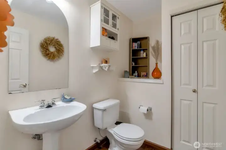 A half-bath with storage provides comfort and convenience - ideal for 2-story living!