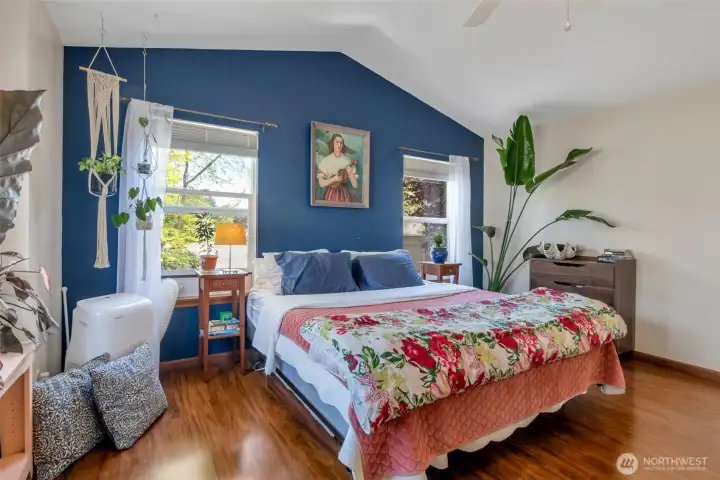 The large primary suite showcases vaulted ceilings, 3 bright windows....