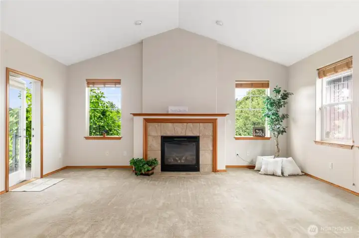 Natural gas fireplace.  View windows and deck to preserved nature land