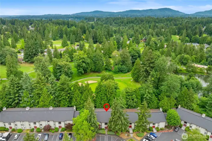 North aerial view of building and golf course