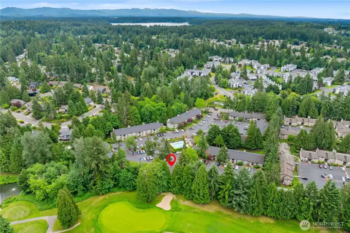 South aerial view of building and golf course
