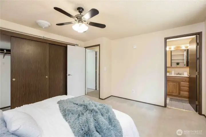 Primary bedroom with a three-quarter bathroom.