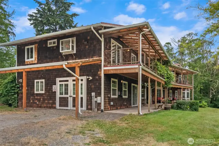 A 2 bed/2 bath apartment above and a garage/studio space below. A 2 bed/2 bath apartment above and a garage/studio space below.