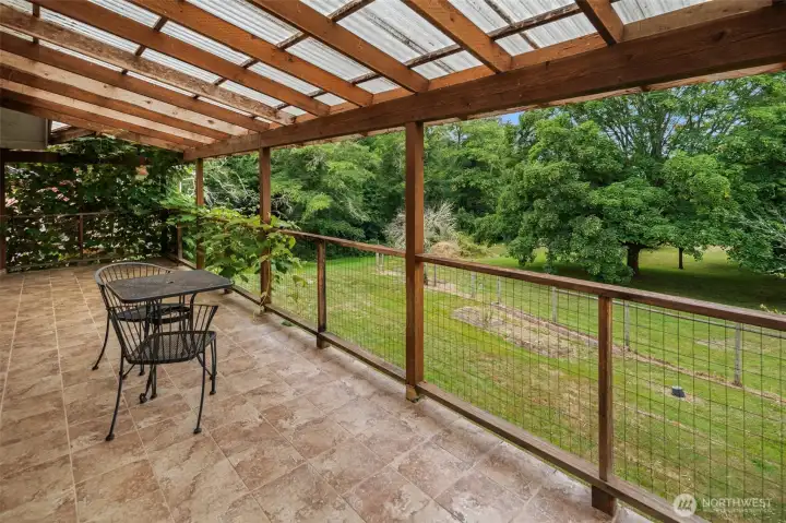 Large covered porch has great views of the property . Large covered porch has great views of the property .