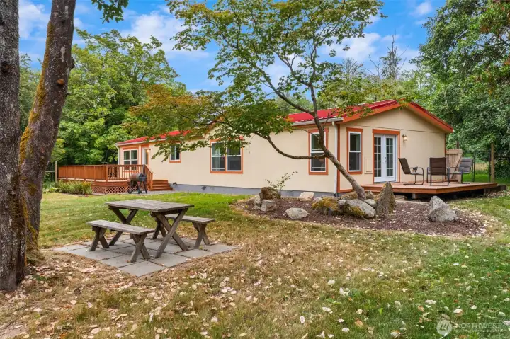Manufactured home has a large fenced back yard. Manufactured home has a large fenced back yard.