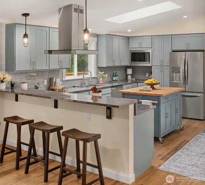 Large gourmet kitchen features ss appliances, marble countertops, large butcher block island and a breakfast bar. Large gourmet kitchen features ss appliances, marble countertops, large butcher block island and a breakfast bar.